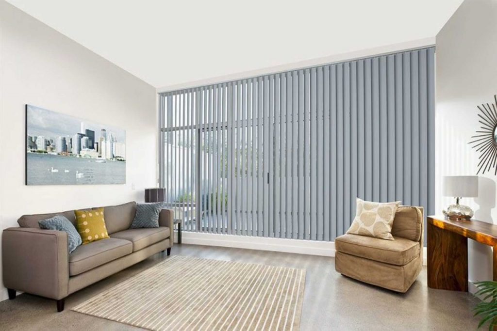 Luxury living room with vertical blinds | Featured image for Blind Cleaning Hacks blog from Cosmopolitan Shutters.